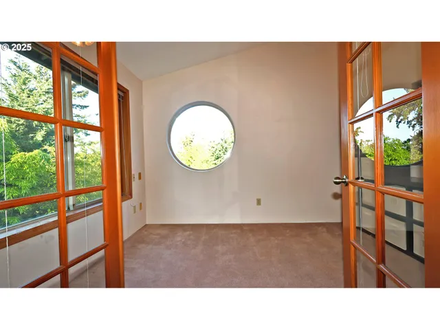 a open kitchen with a sink and glass door