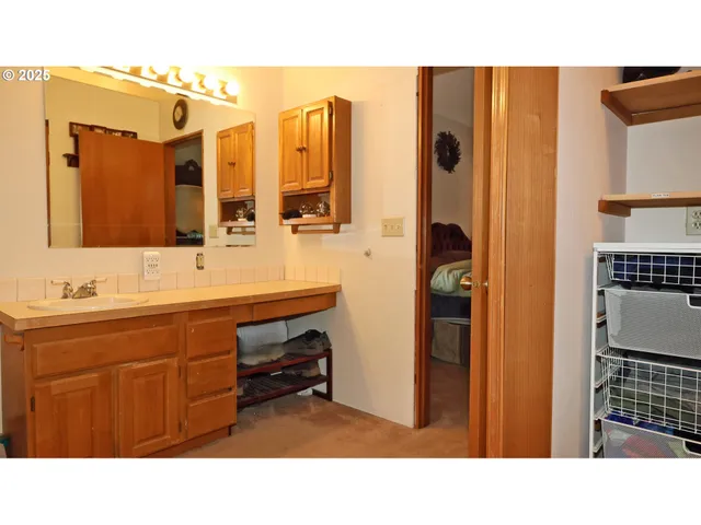 a bathroom with sink and mirror