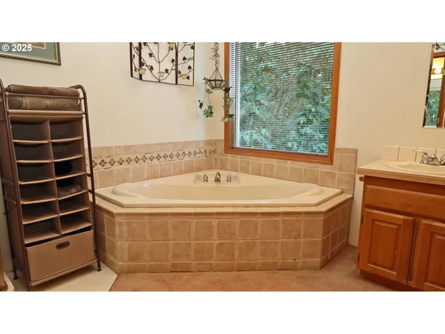 a bathroom with a bathtub and shower
