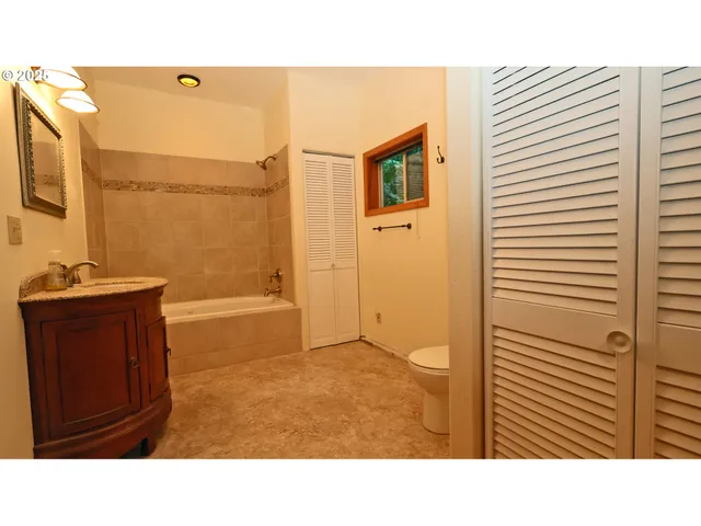 a bathroom with a sink a mirror and a bathtub