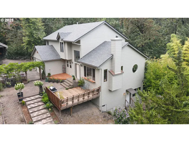 a aerial view of a house with a big yard