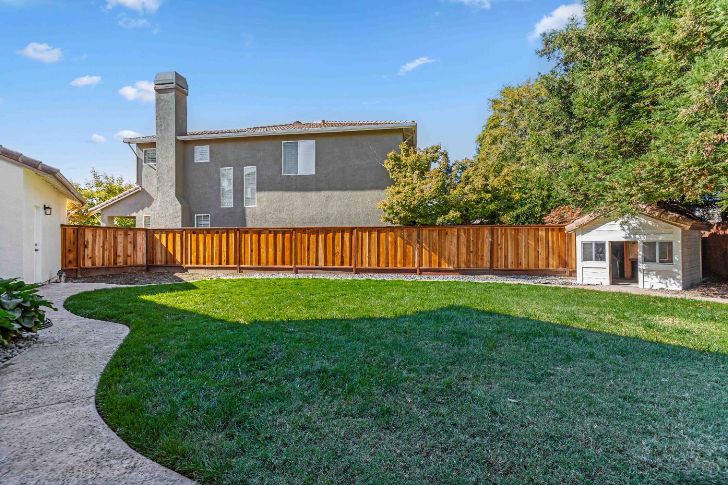 3913 Bayview Drive Modesto, CA 95355 - Photo 16 of 47 a front view of a house with garden