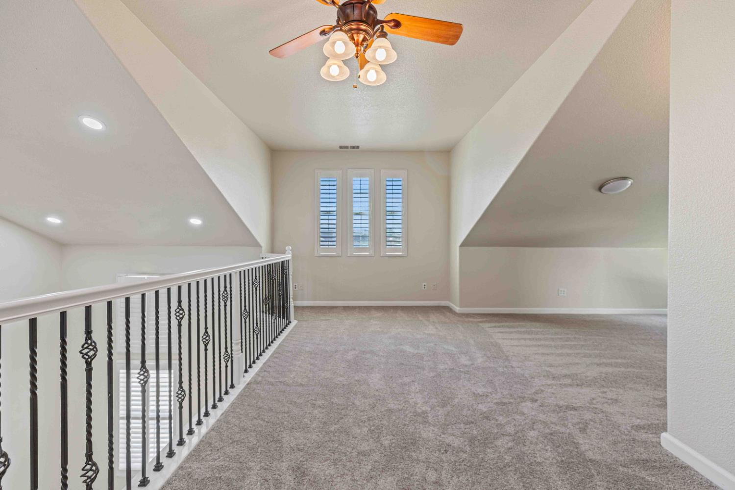 3913 Bayview Drive Modesto, CA 95355 - Photo 17 of 47 an empty room with windows and ceiling fan