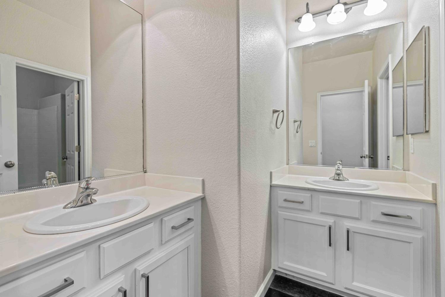 3913 Bayview Drive Modesto, CA 95355 - Photo 24 of 47 a bathroom with a sink and a mirror