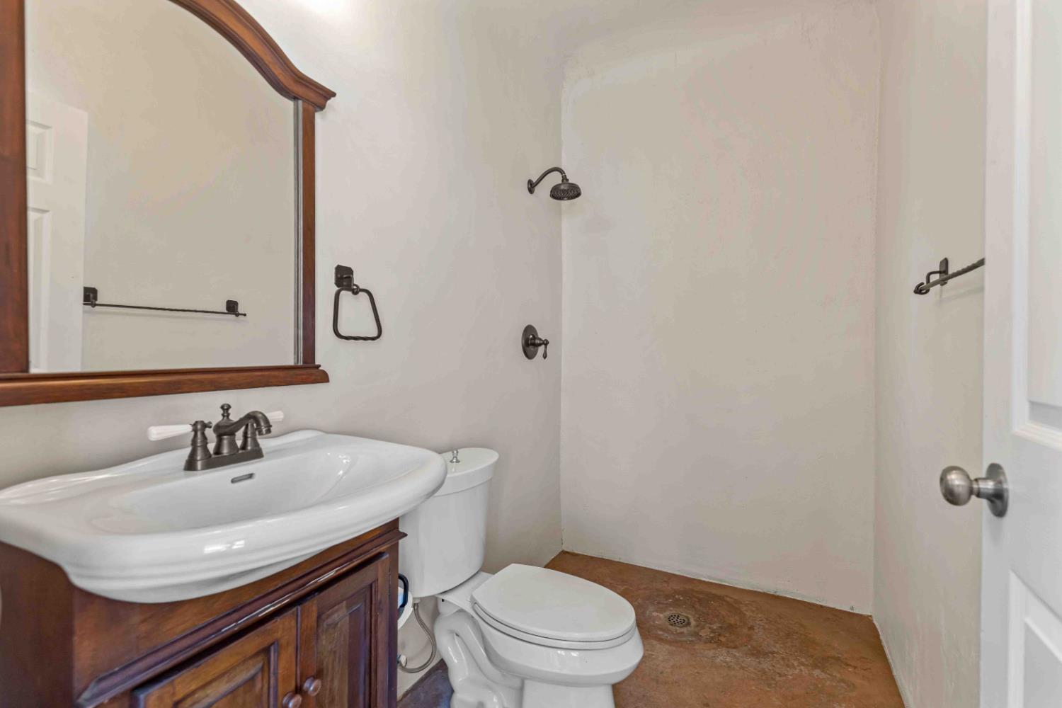 3913 Bayview Drive Modesto, CA 95355 - Photo 32 of 47 a bathroom with a sink toilet and vanity