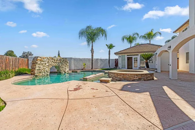 a view of a house with a swimming pool