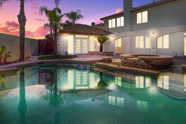 a view of swimming pool having outdoor seating