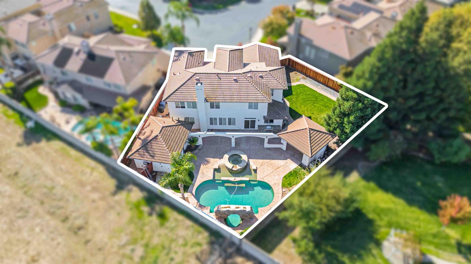 3913 Bayview Drive Modesto, CA 95355 - Photo 4 of 47 an aerial view of a house with swimming pool and garden