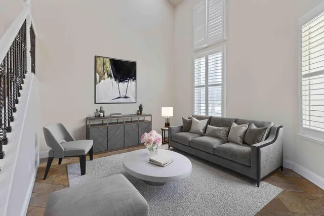 a living room with furniture and window