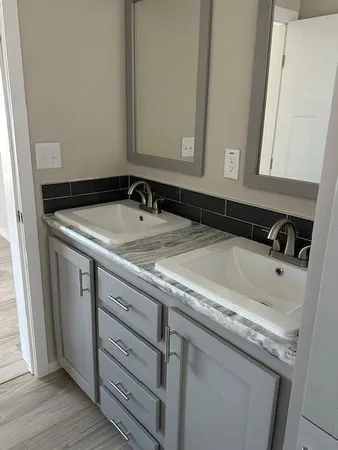 a bathroom with a sink and a mirror