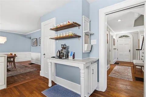 a kitchen with stainless steel appliances granite countertop a stove and wooden floor