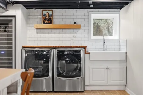 a bathroom with a sink and a window