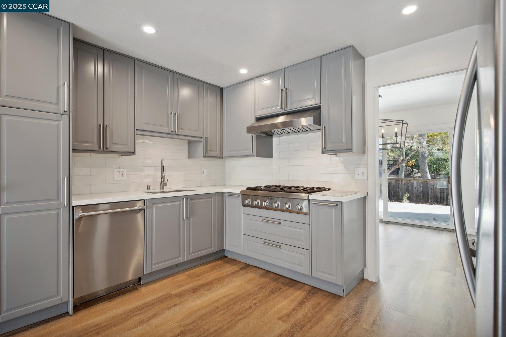 119 Cypress Point Way Moraga, CA 94556 - Photo 11 of 38 a kitchen with a stove a sink and a refrigerator
