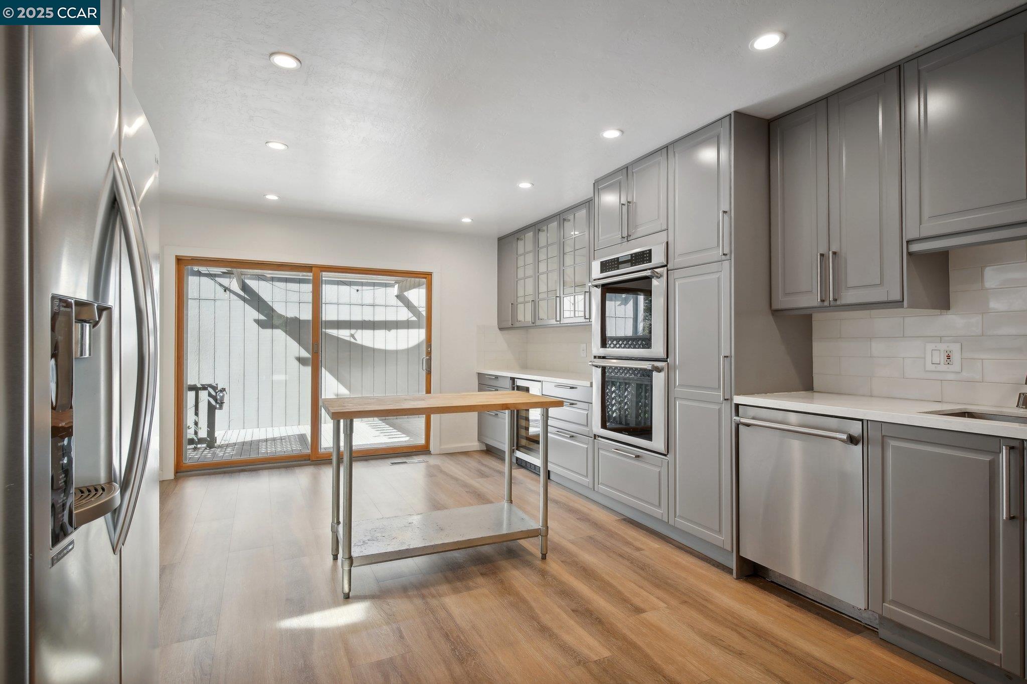 119 Cypress Point Way Moraga, CA 94556 - Photo 12 of 38 a kitchen with stainless steel appliances granite countertop a refrigerator sink and cabinets