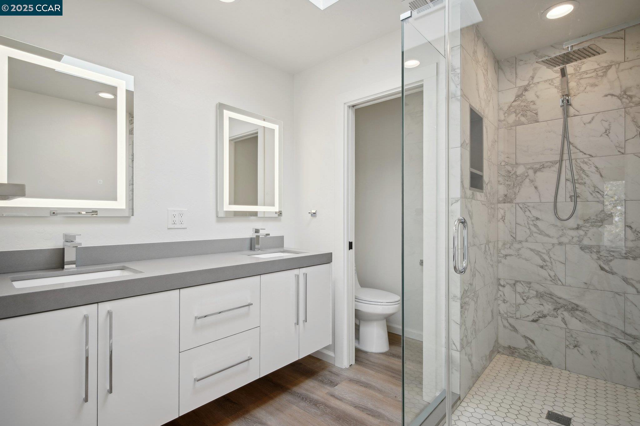 119 Cypress Point Way Moraga, CA 94556 - Photo 18 of 38 a bathroom with a double vanity sink toilet and shower