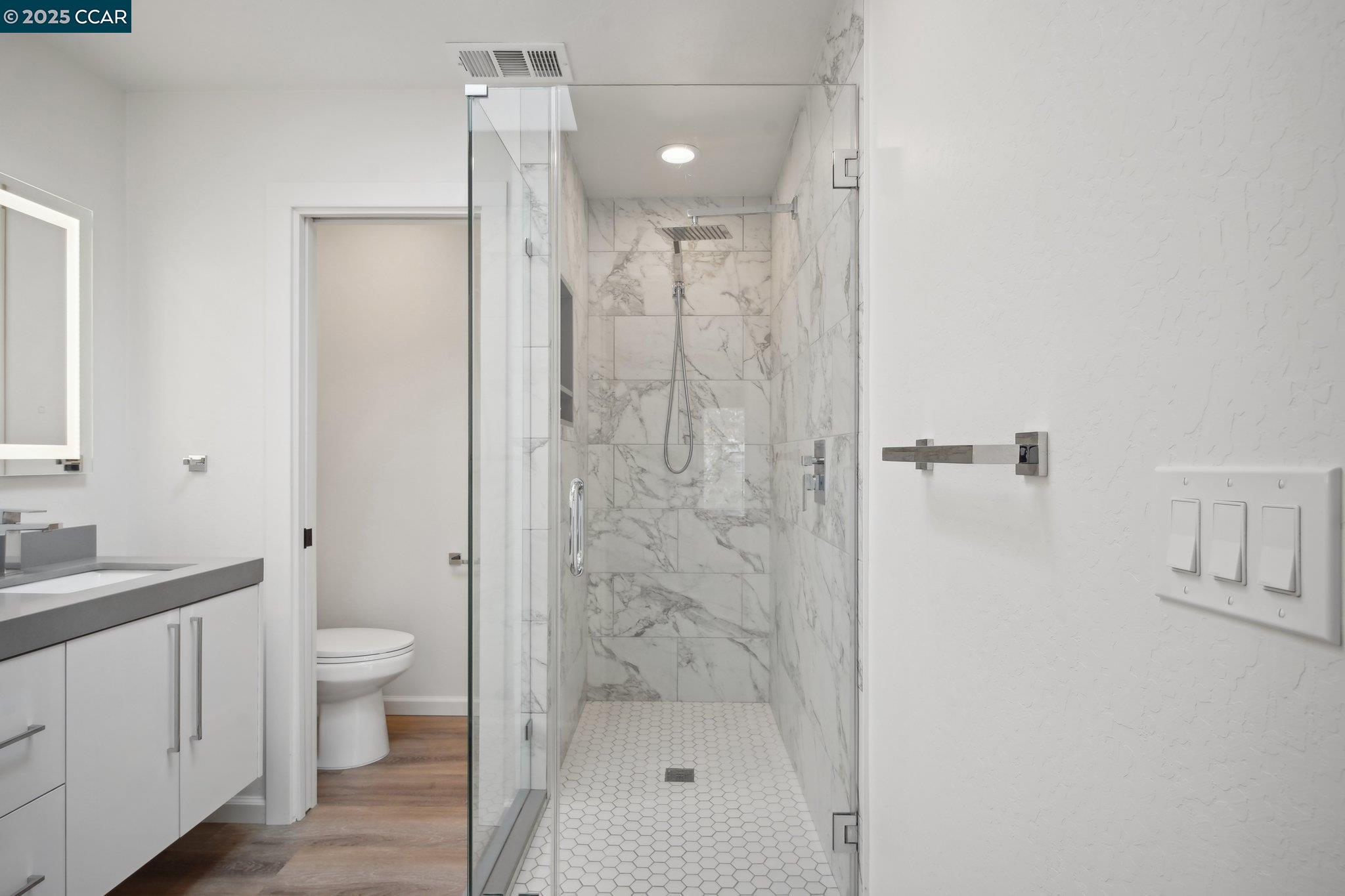 119 Cypress Point Way Moraga, CA 94556 - Photo 21 of 38 a bathroom with a shower a toilet and sink