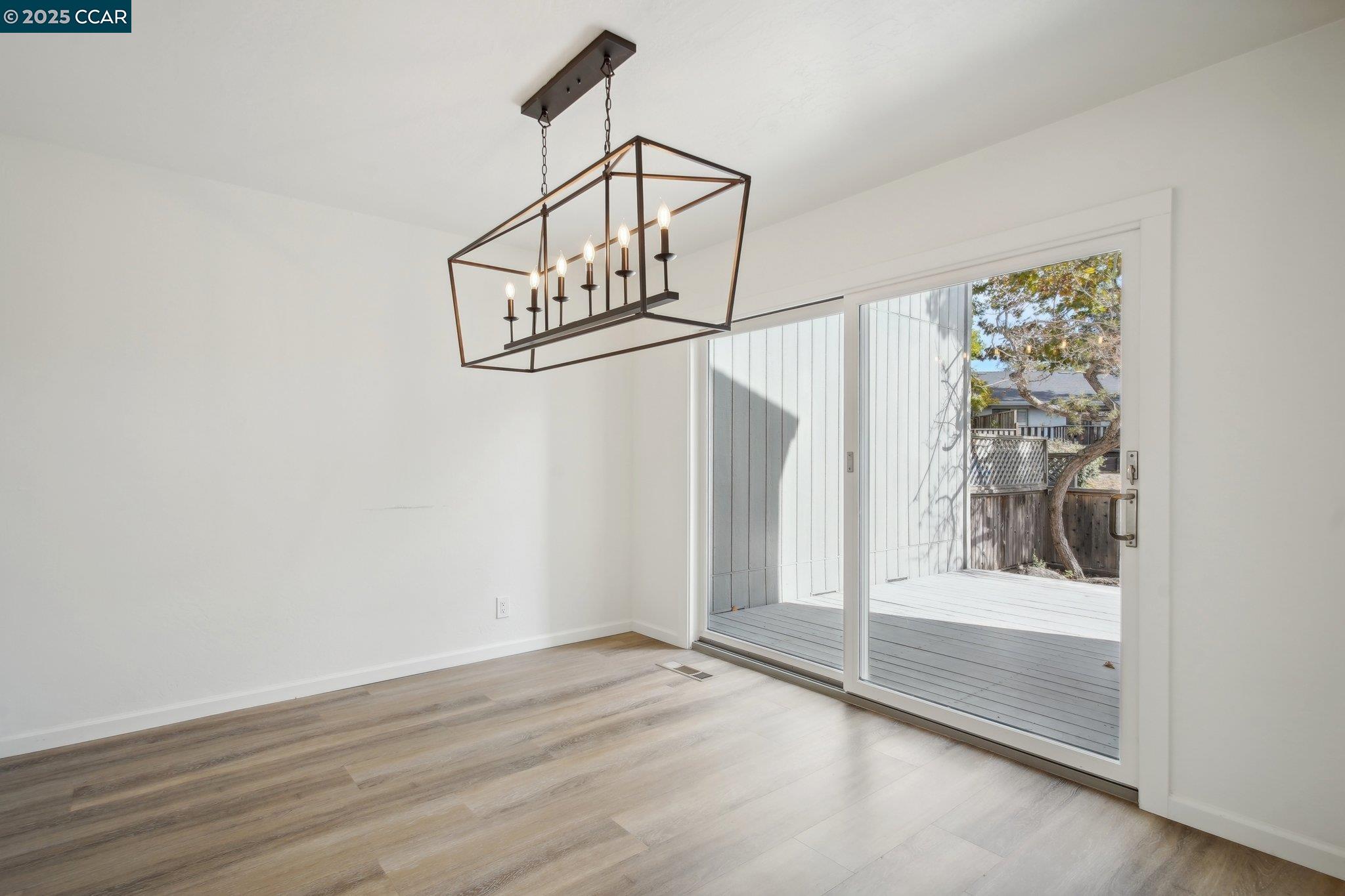 119 Cypress Point Way Moraga, CA 94556 - Photo 7 of 38 a view of a room with wooden floor door and windows