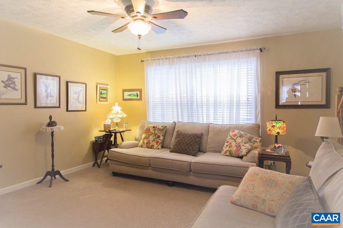 33 Riverside Drive Palmyra, VA 22963 - Photo 2 of 10 a living room with furniture and a window