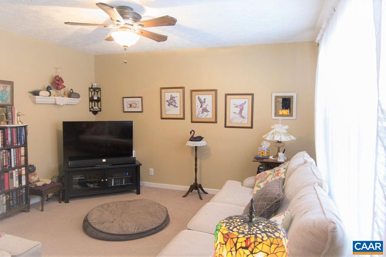 33 Riverside Drive Palmyra, VA 22963 - Photo 3 of 10 a living room with furniture and a flat screen tv