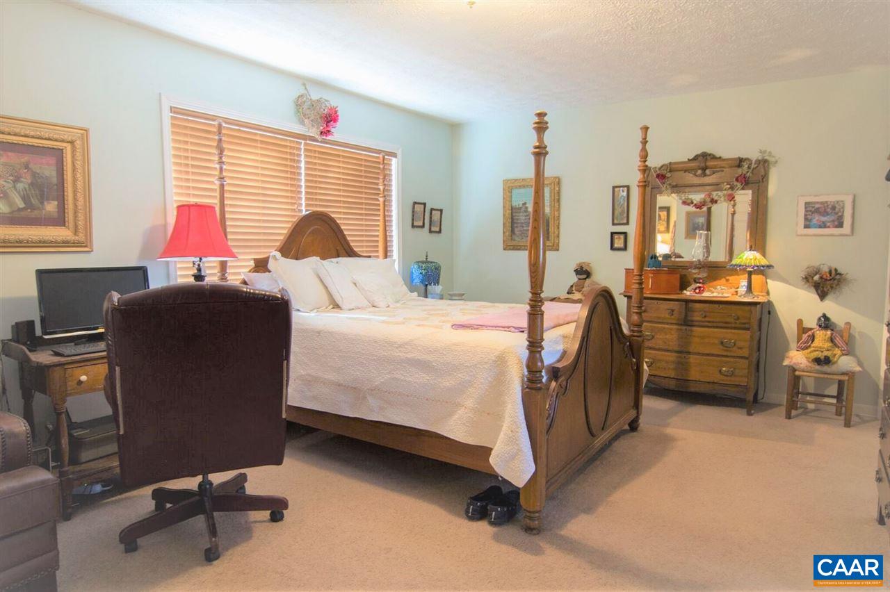 33 Riverside Drive Palmyra, VA 22963 - Photo 6 of 10 a bedroom with a bed and a desk