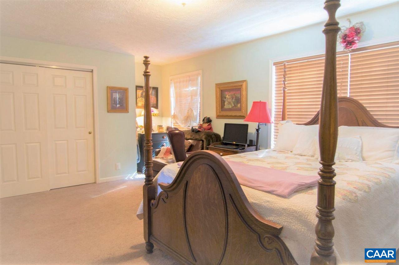 33 Riverside Drive Palmyra, VA 22963 - Photo 7 of 10 a bed room with a bed and a chair