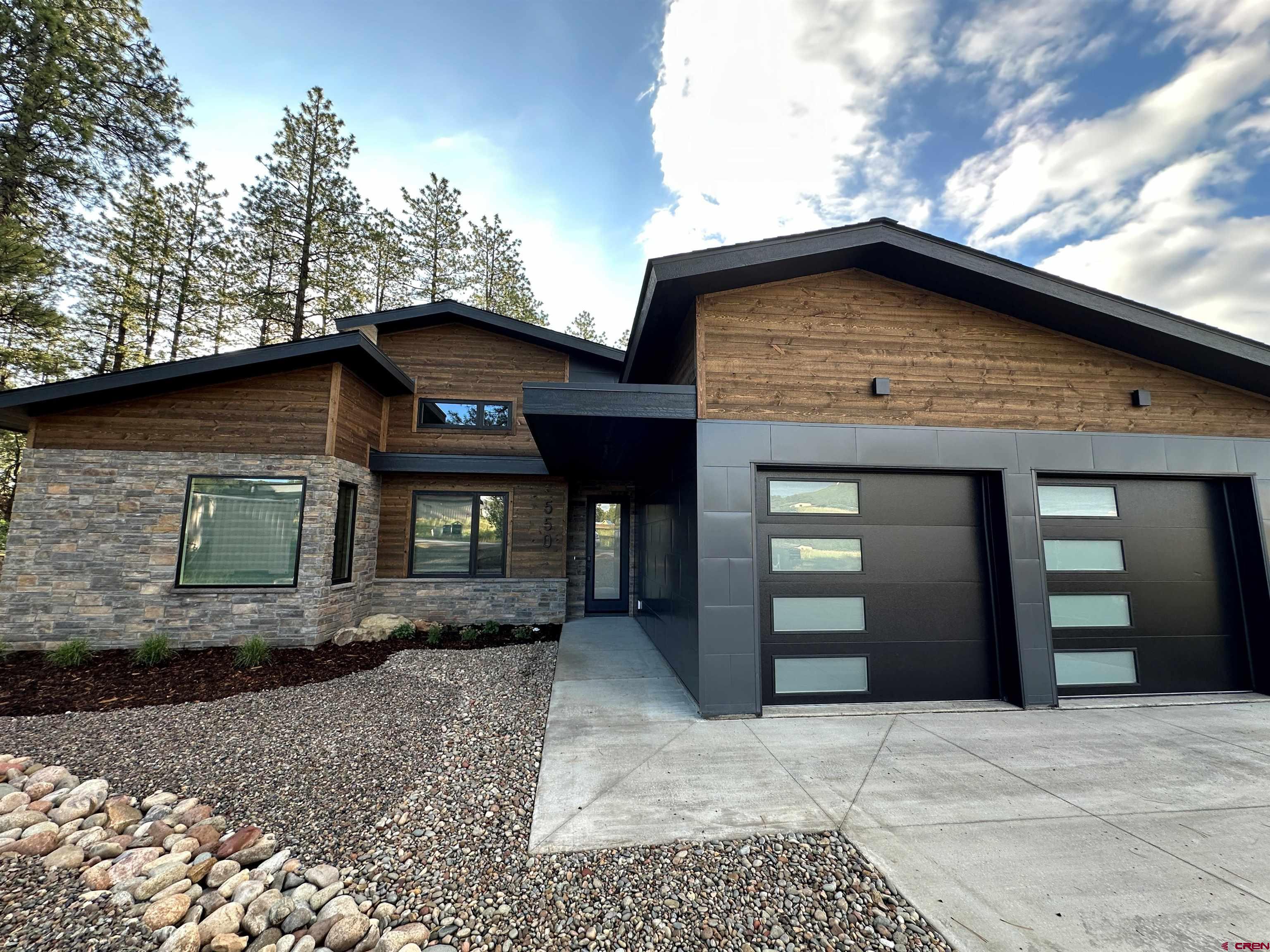 550 Edgemont Meadows Road Durango, CO 81301 - Photo 2 of 4 a front view of a house with a yard