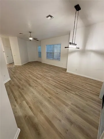 a kitchen with stainless steel appliances a refrigerator sink and microwave