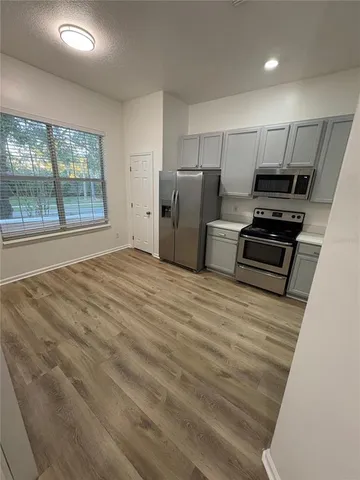 a bathroom with 2 sink tub and a mirror
