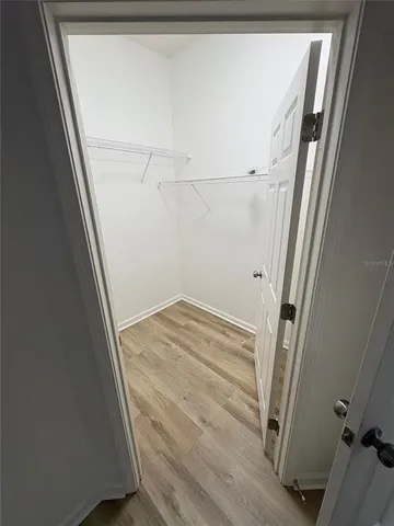 a bathroom with double vanity sink and mirror