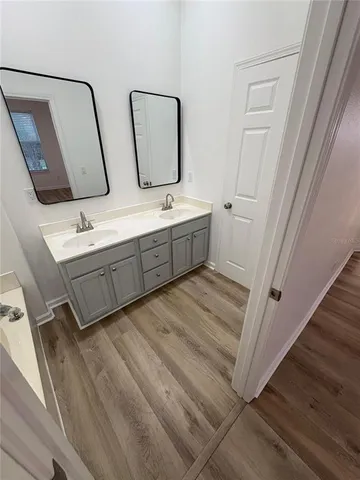a bathroom with a glass door shower