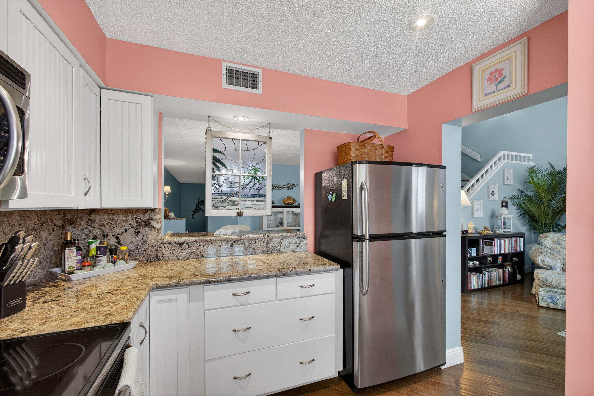 1206 Mainsail Circle Jupiter, FL 33477 - Photo 26 of 46 a kitchen with refrigerator a microwave a stove and cabinets