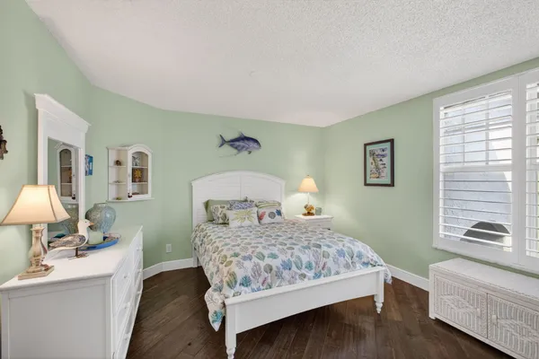 a bedroom with a bed and a table in it