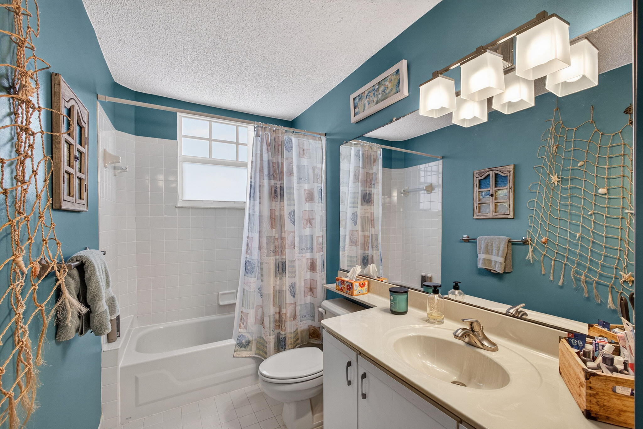 1206 Mainsail Circle Jupiter, FL 33477 - Photo 34 of 46 a bathroom with a sink a toilet and a bathtub