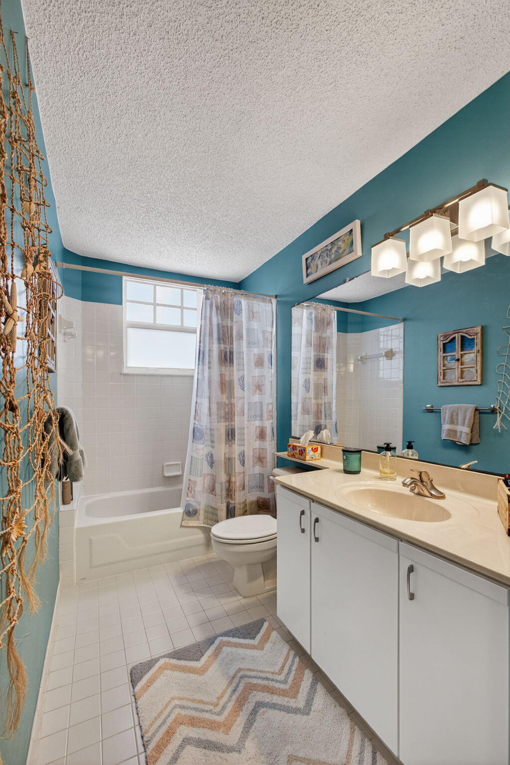 1206 Mainsail Circle Jupiter, FL 33477 - Photo 36 of 46 a bathroom with a granite countertop sink and a mirror