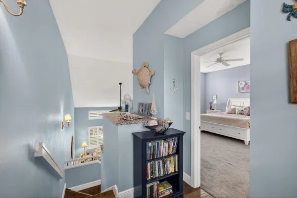 a bedroom with furniture and a wooden floor