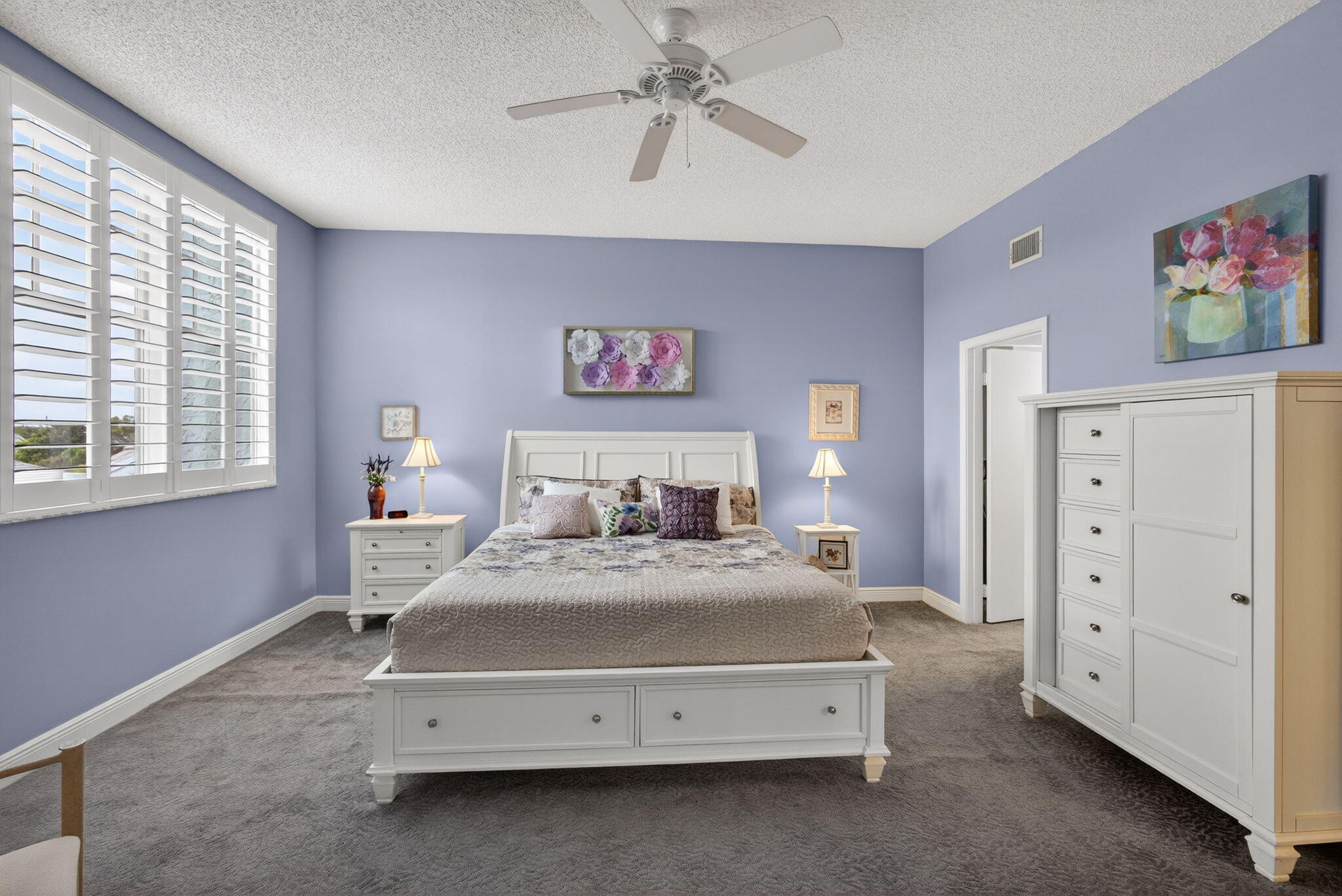 1206 Mainsail Circle Jupiter, FL 33477 - Photo 40 of 46 a bedroom with a bed and a chandelier