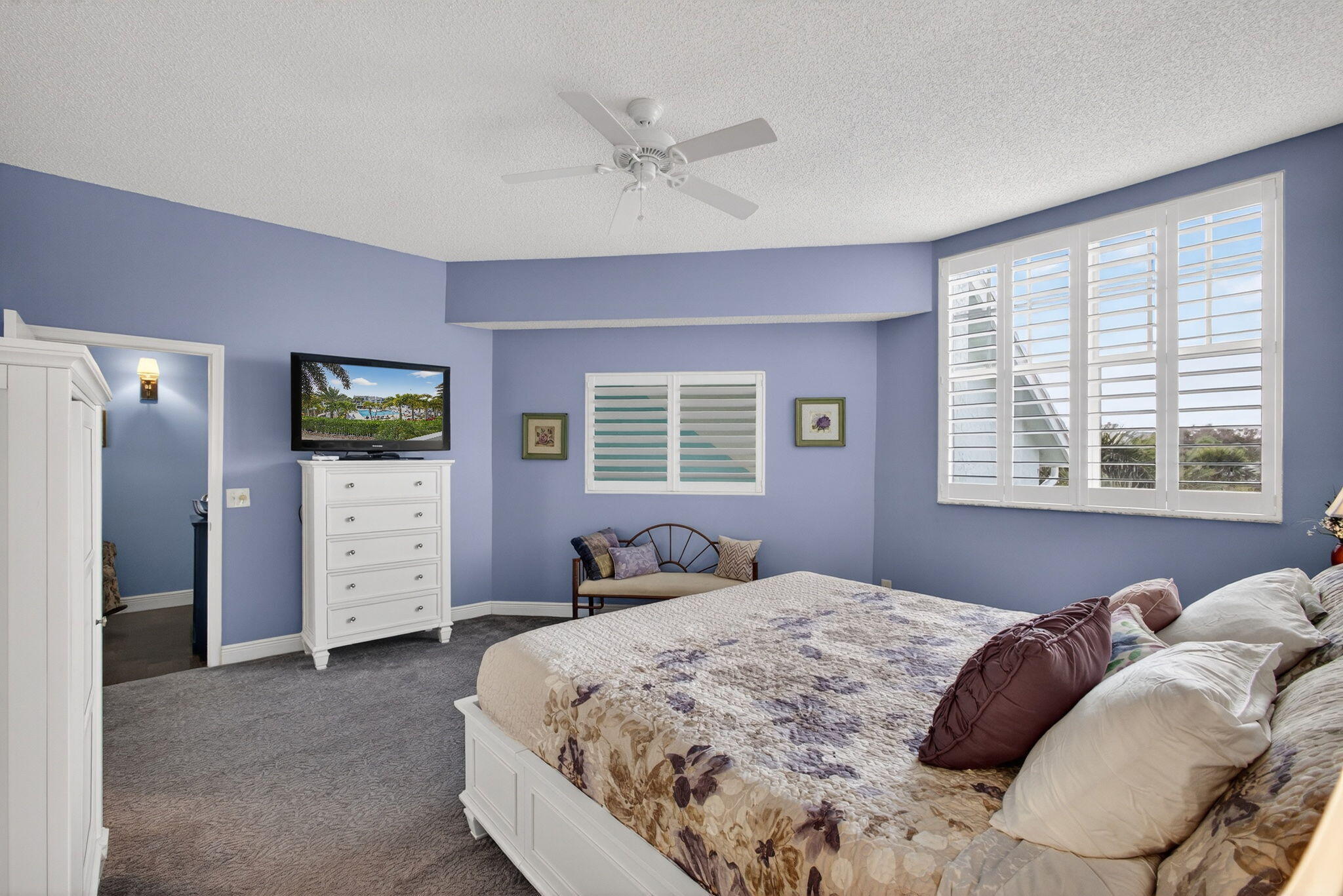 1206 Mainsail Circle Jupiter, FL 33477 - Photo 42 of 46 a bedroom with a bed and a ceiling fan
