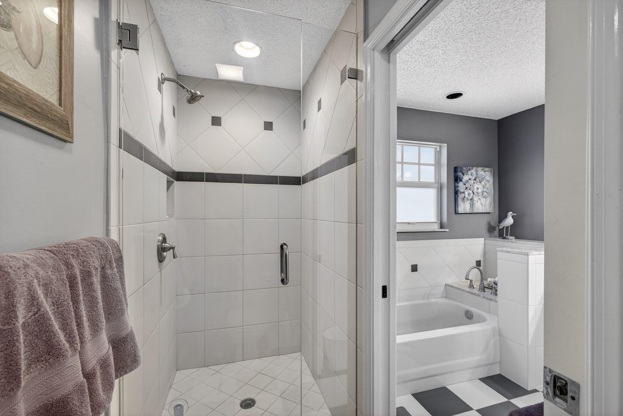1206 Mainsail Circle Jupiter, FL 33477 - Photo 46 of 46 a bathroom with a bathtub and a shower