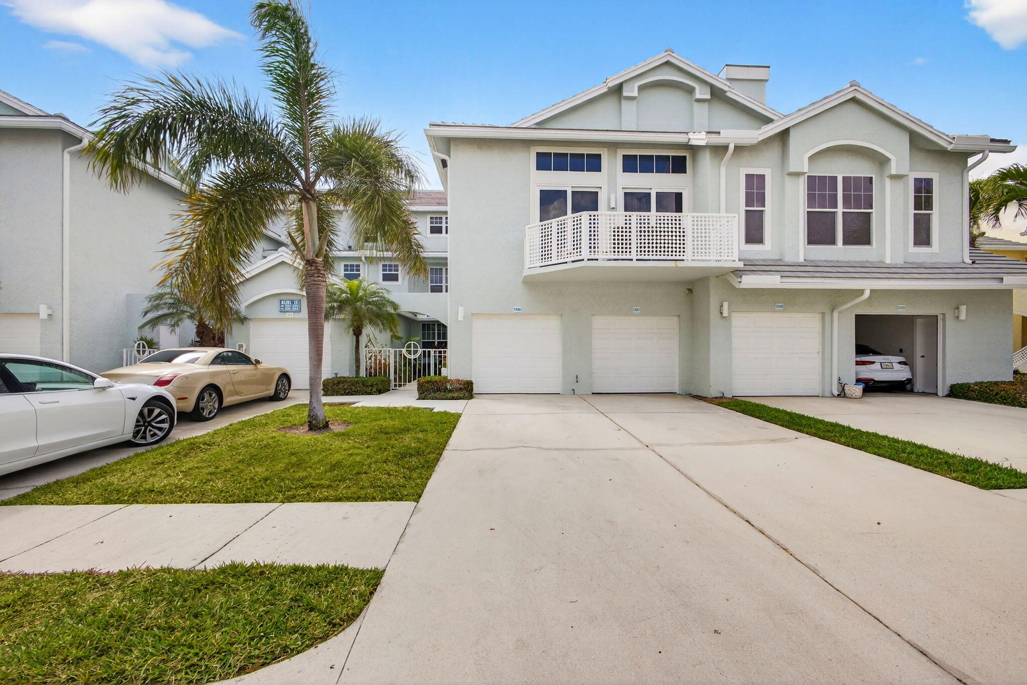 1206 Mainsail Circle Jupiter, FL 33477 - Photo 8 of 46 a front view of a house with a yard and garage