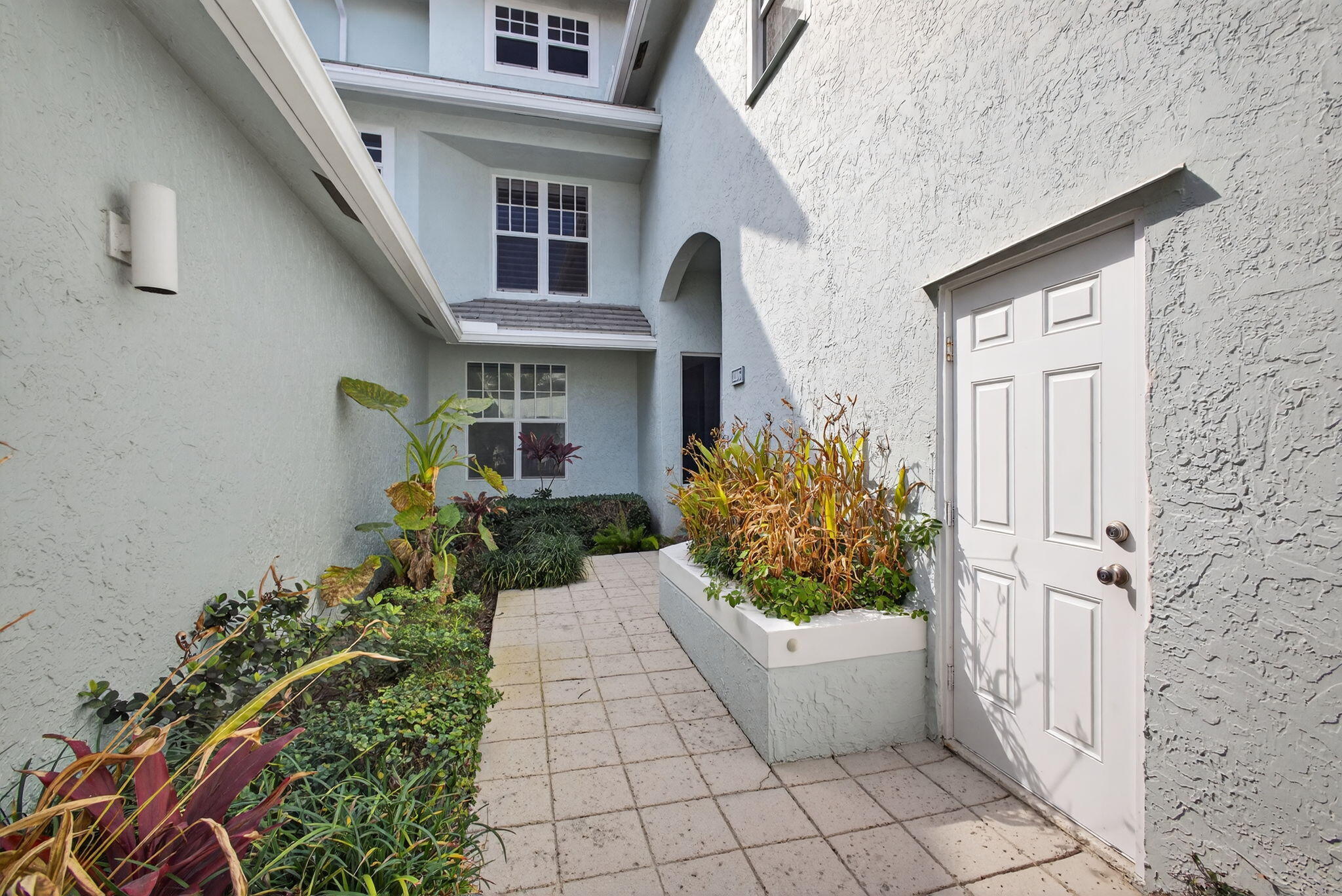 1206 Mainsail Circle Jupiter, FL 33477 - Photo 10 of 46 a front view of a house with a garden