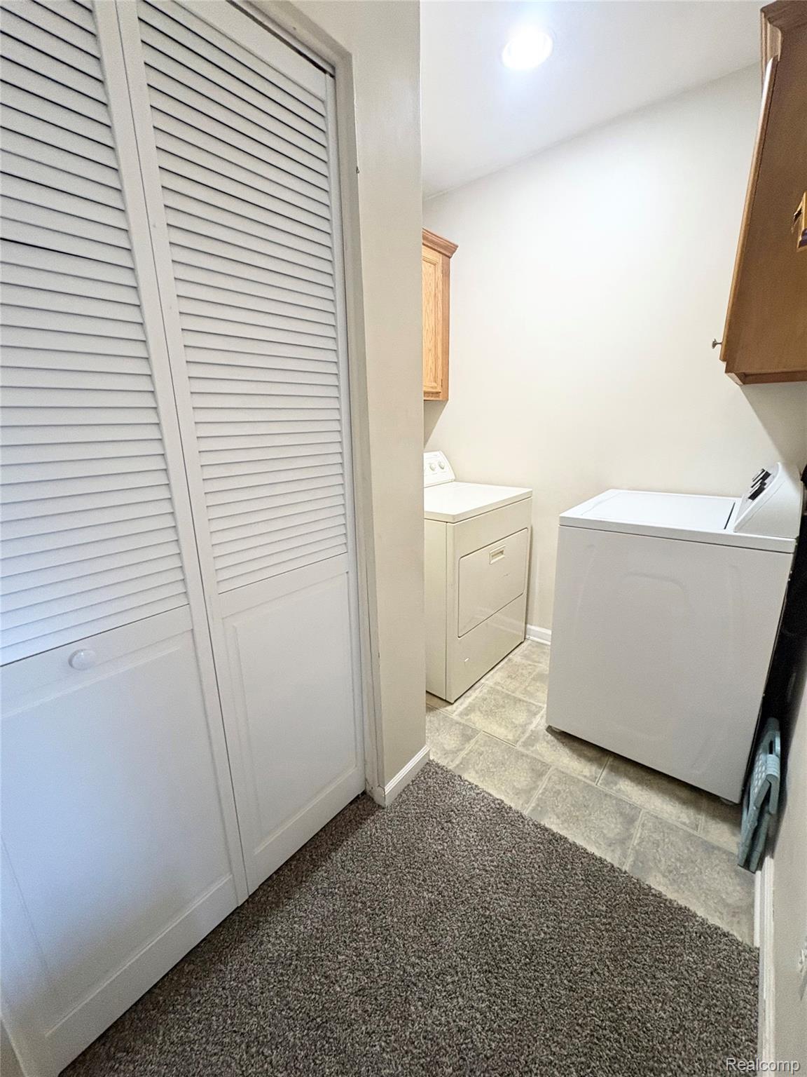 2230 North Center Road Burton, MI 48509 - Photo 18 of 21 Laundry room with cabinet space, washer and clothes dryer, light carpet, and recessed lighting