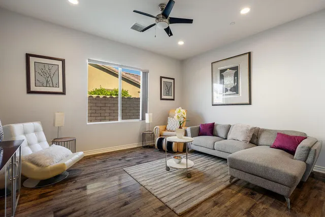 a kitchen with stainless steel appliances granite countertop a refrigerator a stove and a sink