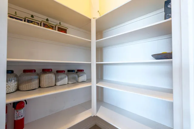 a bathroom with a granite countertop sink and a bathtub