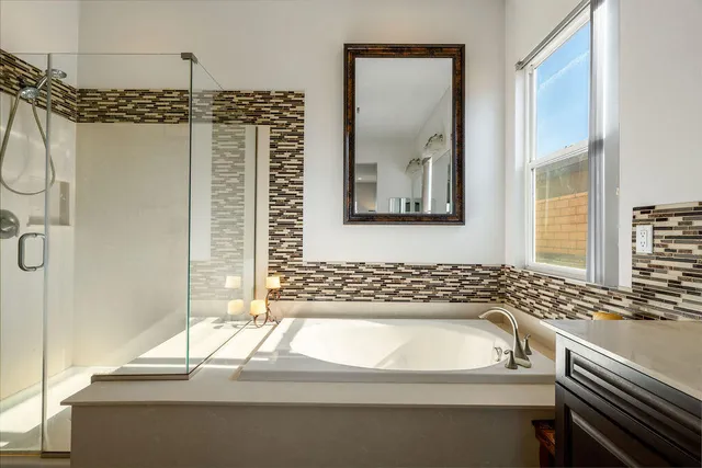 a view of a patio with table and chairs with wooden floor and plants