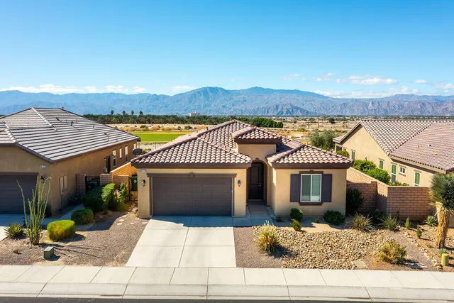 a living room with furniture gym equipment and a large window