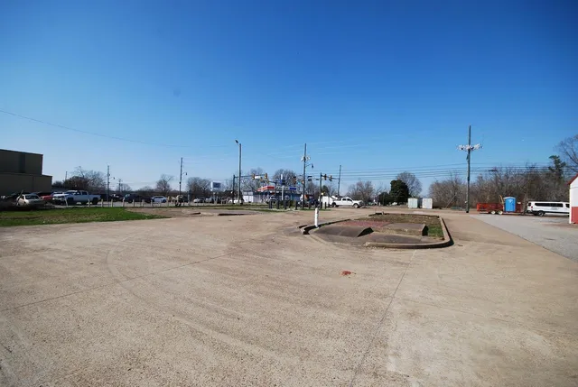 a view of swimming pool with outdoor seating and city view