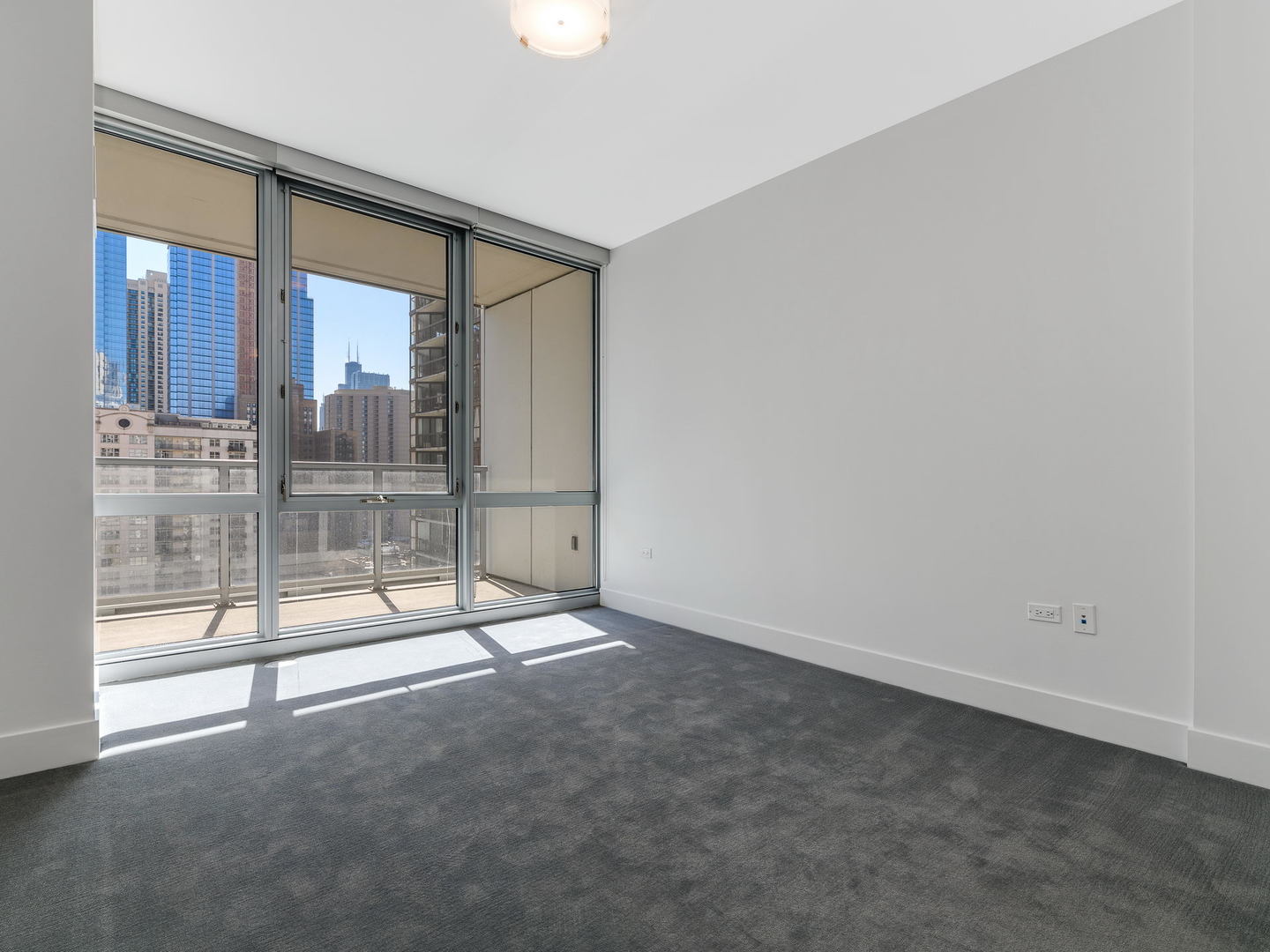 2 West Delaware Place, Unit 130304 Chicago, IL 60610 - Photo 13 of 15 a view of empty room with floor to ceiling window