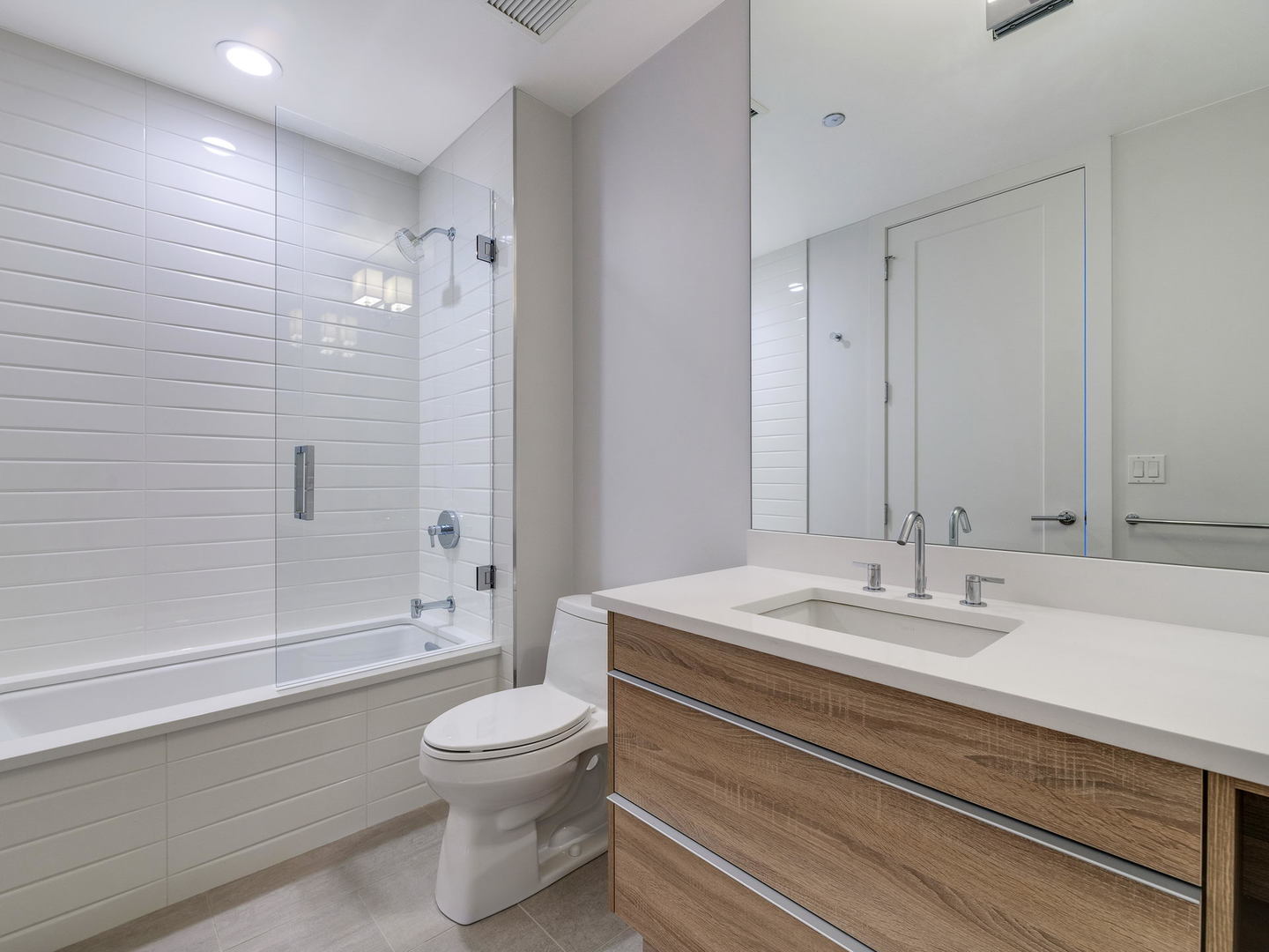 2 West Delaware Place, Unit 130304 Chicago, IL 60610 - Photo 14 of 15 a bathroom with a sink a toilet and shower