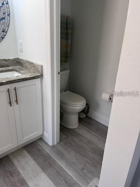 5519 Turtle Crossing Loop Tampa, FL 33625 - Photo 15 of 23 a bathroom with a granite countertop toilet and a sink
