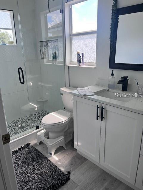 5519 Turtle Crossing Loop Tampa, FL 33625 - Photo 20 of 23 a bathroom with a toilet a sink and mirror